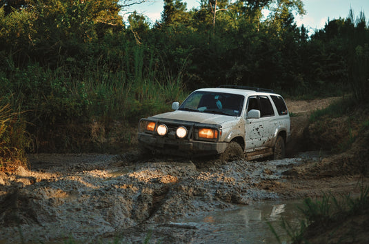 White 4Runner stuck in deep mud. Photo by Jeff James.