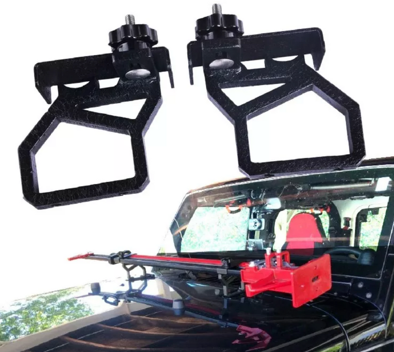 Load image into Gallery viewer, Detail of jack brackets with black jeep installed with jack

