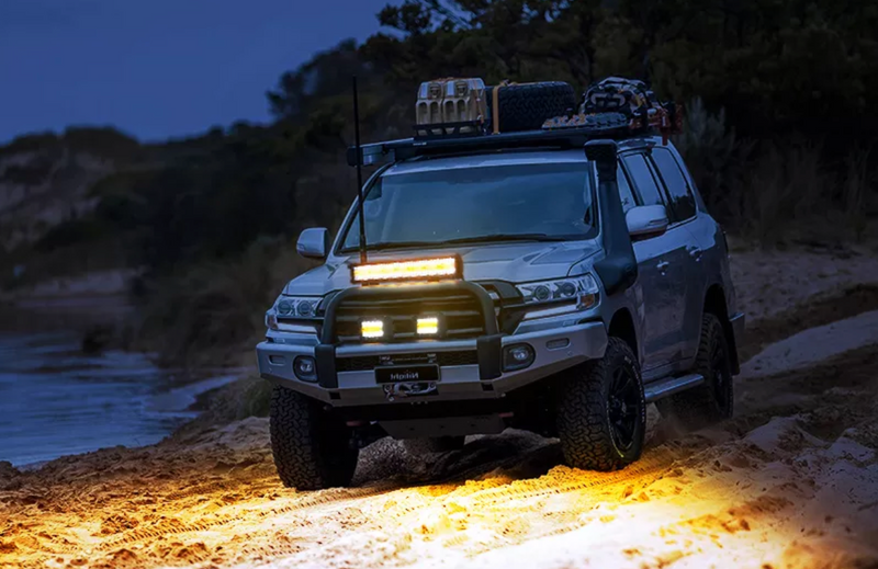 Load image into Gallery viewer, Detail of light installed on 4runner on beach at night
