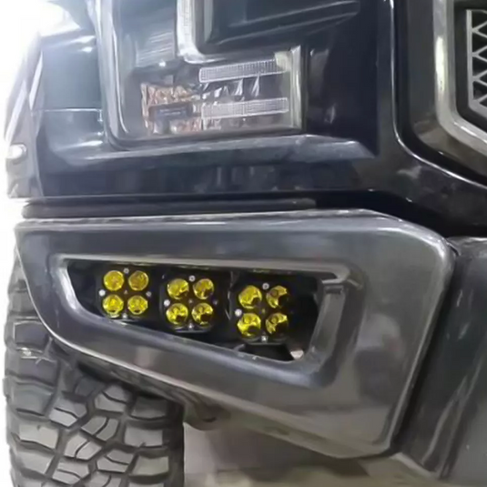 Three lights installed in 'fog' position in truck bumper