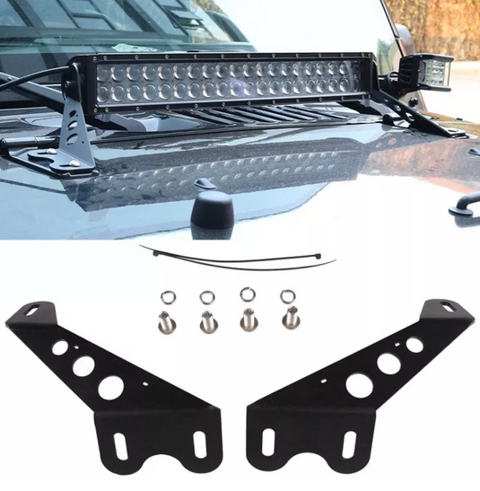 Light bar installed on jeep with brackets and hardware in foreground