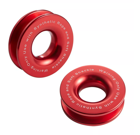 Two red snatch rings bearing "warning: only use with synthetic rope and soft shackle"